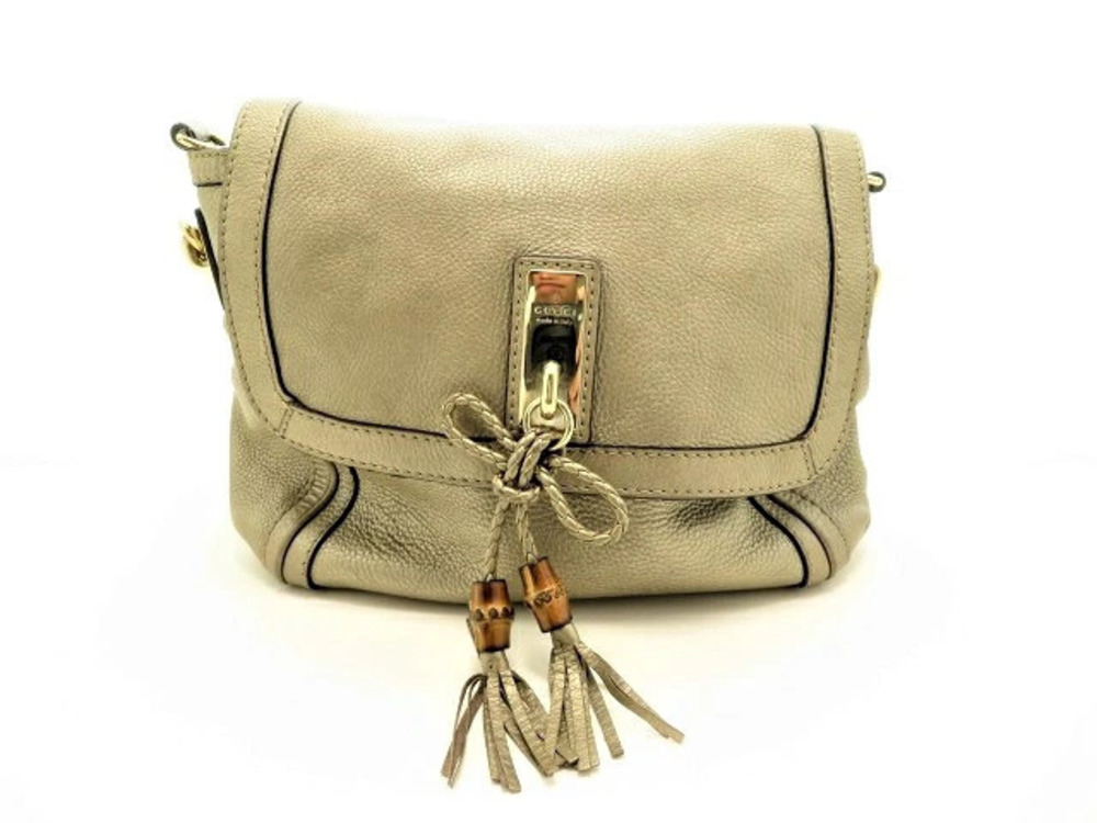 Gucci shoulder bag embossed gold